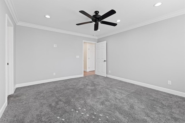 spare room featuring ceiling fan, ornamental molding, and carpet floors