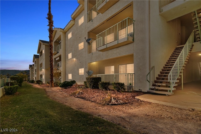 view of outdoor building at dusk