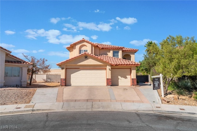 mediterranean / spanish-style home featuring a garage