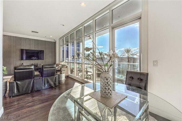 4525 Dean Martin Dr Unit 302, Las Vegas, NV 89103 - dining space with plenty of natural light, wallpapered walls, wood finished floors, ornamental molding, and recessed lighting