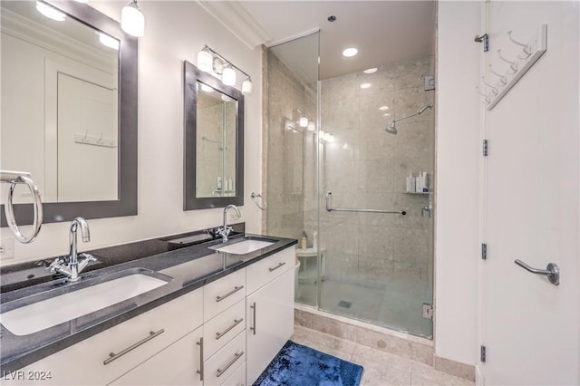 4525 Dean Martin Dr Unit 302, Las Vegas, NV 89103 - full bathroom featuring double vanity, a stall shower, tile patterned floors, recessed lighting, and crown molding