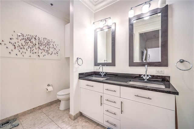 4525 Dean Martin Dr Unit 302, Las Vegas, NV 89103 - bathroom featuring crown molding, double vanity, and tile patterned floors