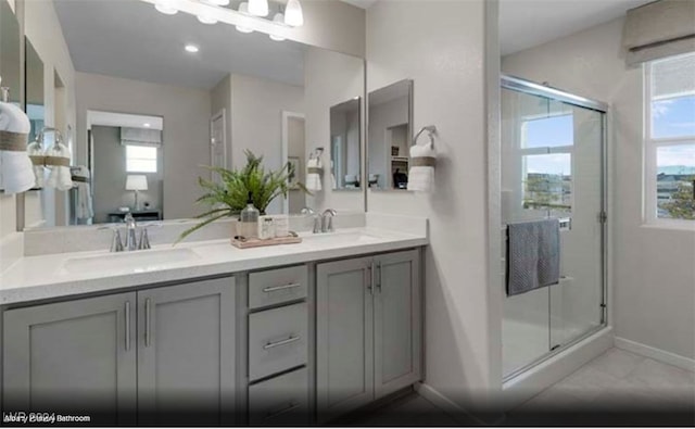 bathroom with vanity and walk in shower