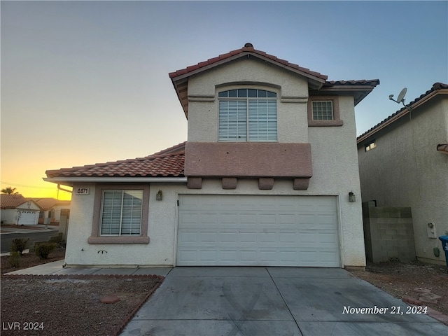 view of front of home with a garage