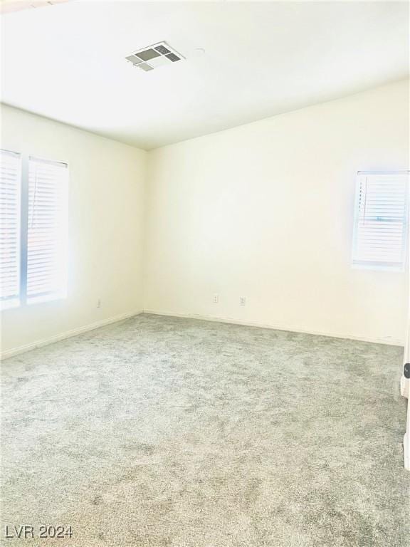 empty room featuring carpet flooring