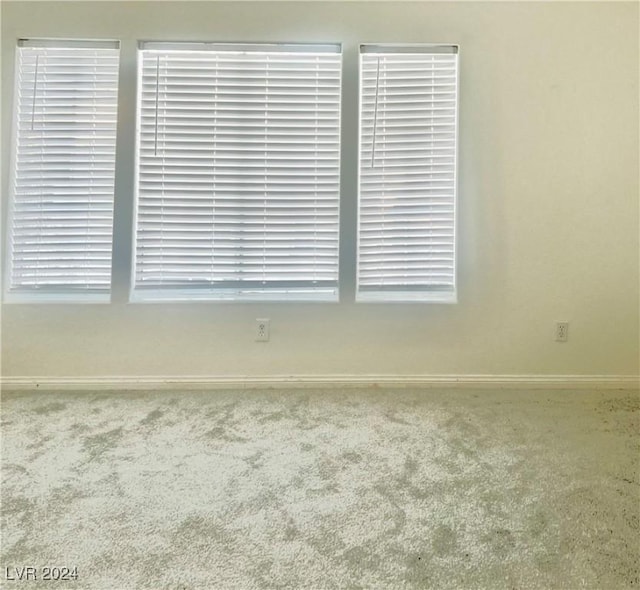 empty room featuring carpet floors