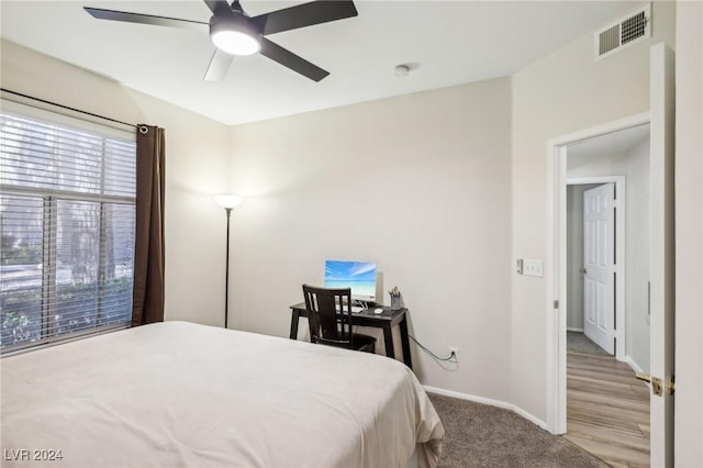 bedroom featuring ceiling fan and light colored carpet