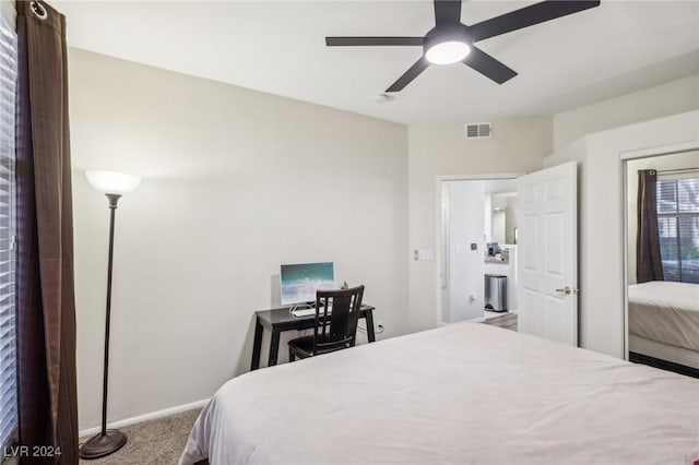 bedroom featuring ceiling fan and carpet