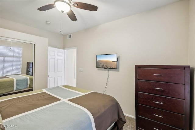 bedroom with ceiling fan and carpet