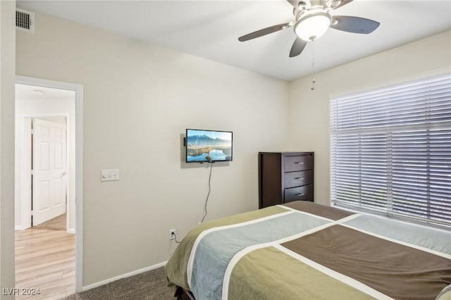 bedroom with ceiling fan and carpet floors