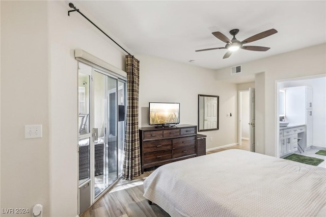 bedroom featuring ensuite bathroom, ceiling fan, light hardwood / wood-style flooring, and access to exterior