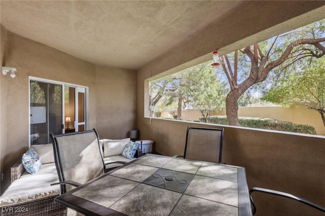 view of patio / terrace with a balcony