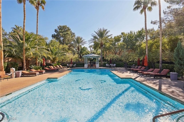 view of swimming pool featuring a patio area