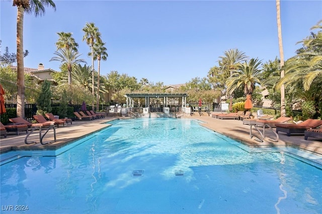 view of swimming pool with a pergola and a patio area