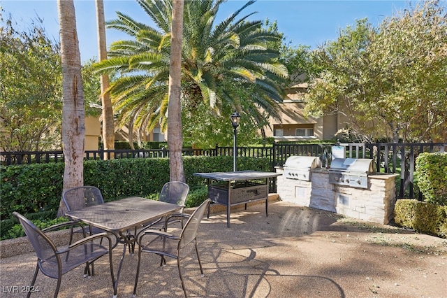 view of patio / terrace with an outdoor kitchen and a grill