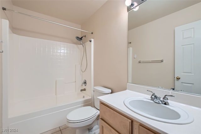 full bathroom with bathing tub / shower combination, tile patterned flooring, vanity, and toilet