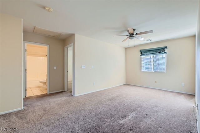 carpeted empty room featuring ceiling fan