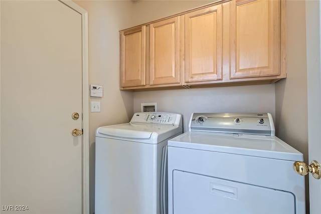 laundry area featuring cabinets and independent washer and dryer