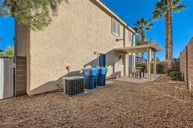 back of property with a patio and cooling unit