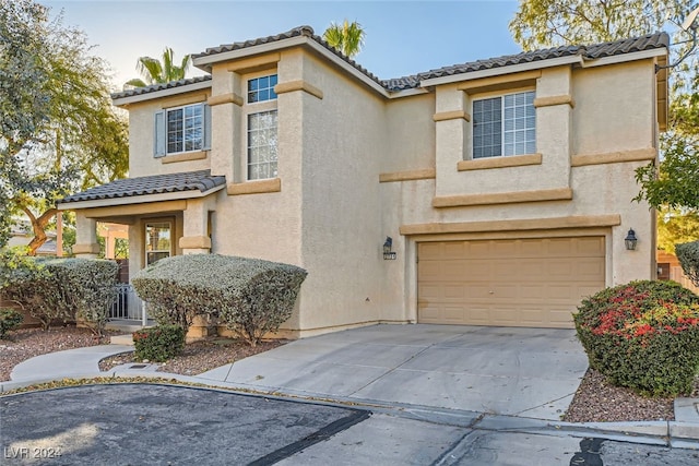 mediterranean / spanish-style house featuring a garage