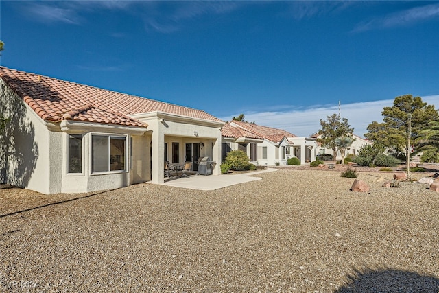 back of house with a patio area