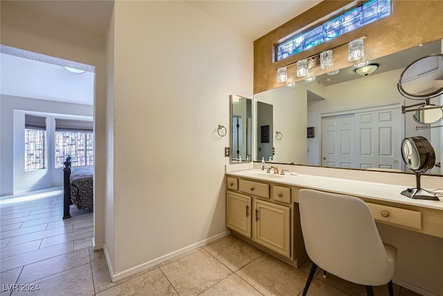 bathroom featuring tile patterned flooring and vanity