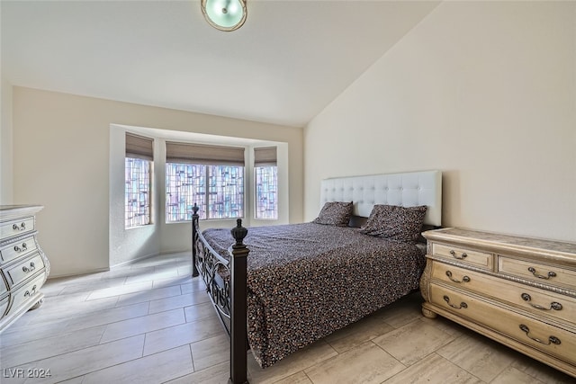 bedroom featuring vaulted ceiling