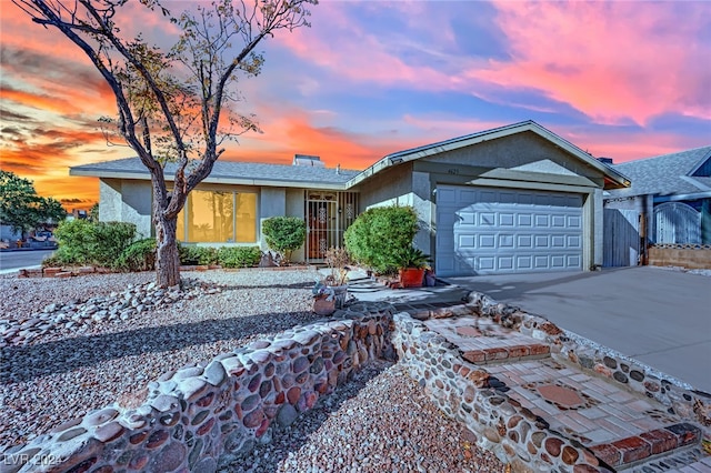 ranch-style home featuring a garage