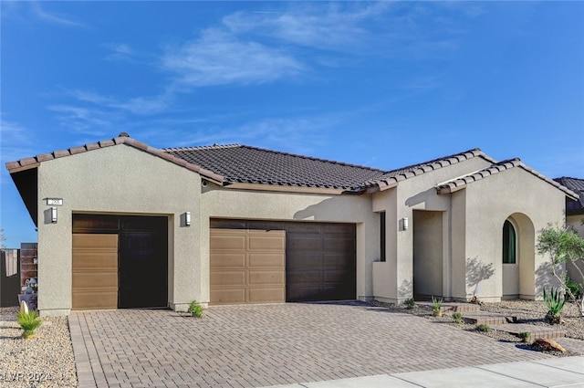 view of front of home with a garage