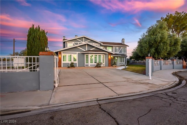 view of front facade featuring a fenced front yard and a gate