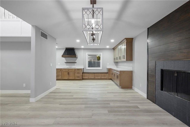 kitchen with baseboards, light countertops, visible vents, and light wood-style floors