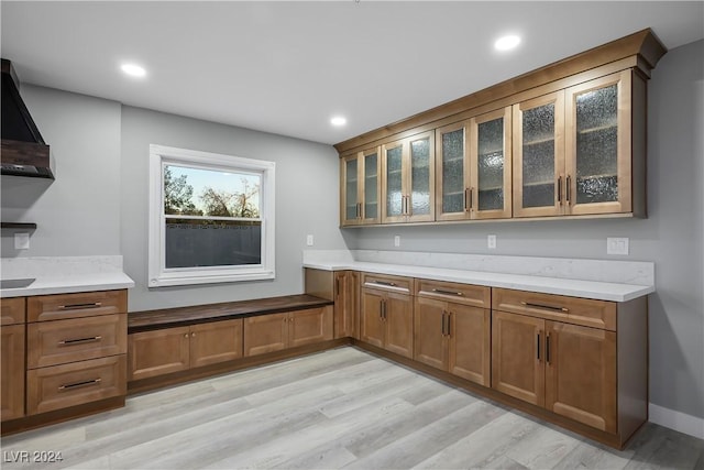 bar with light wood finished floors and recessed lighting
