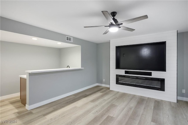 unfurnished living room featuring light wood-type flooring, visible vents, baseboards, ceiling fan, and recessed lighting