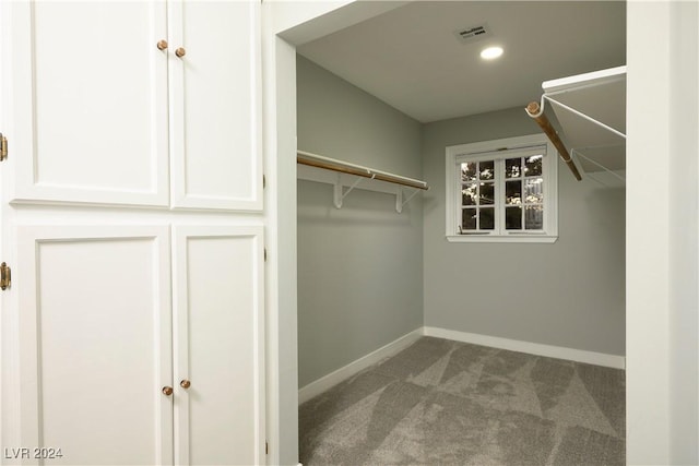 walk in closet with carpet and visible vents