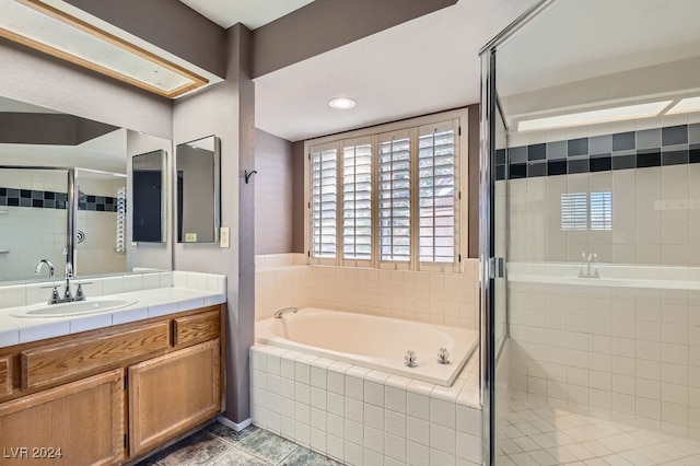 bathroom featuring separate shower and tub, tile patterned flooring, and vanity