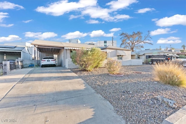 view of front of home with a carport