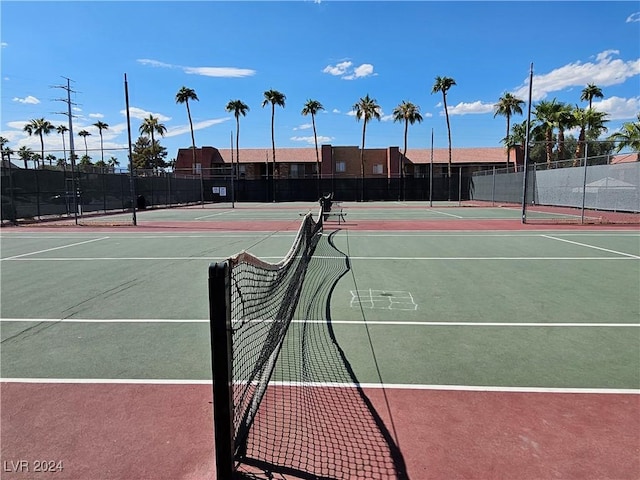 view of tennis court featuring basketball court