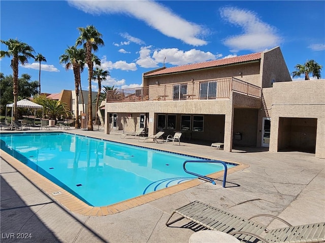 view of swimming pool with a patio area