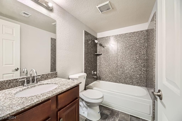 full bathroom featuring vanity, a textured ceiling, tiled shower / bath combo, tile patterned flooring, and toilet