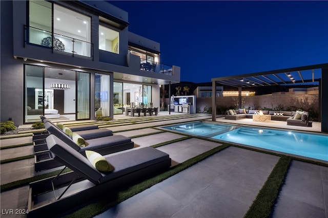 pool at twilight featuring a pergola, an outdoor living space, and a patio