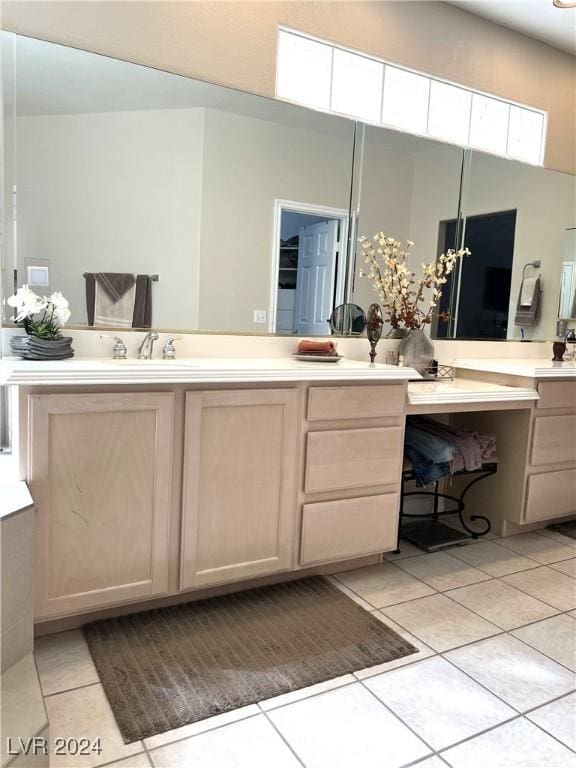 bathroom featuring tile patterned flooring and vanity