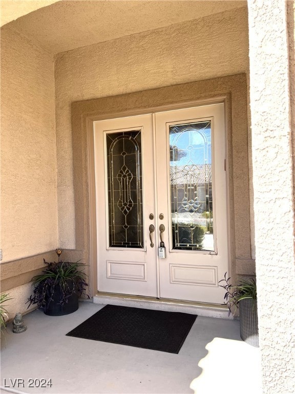 property entrance featuring french doors