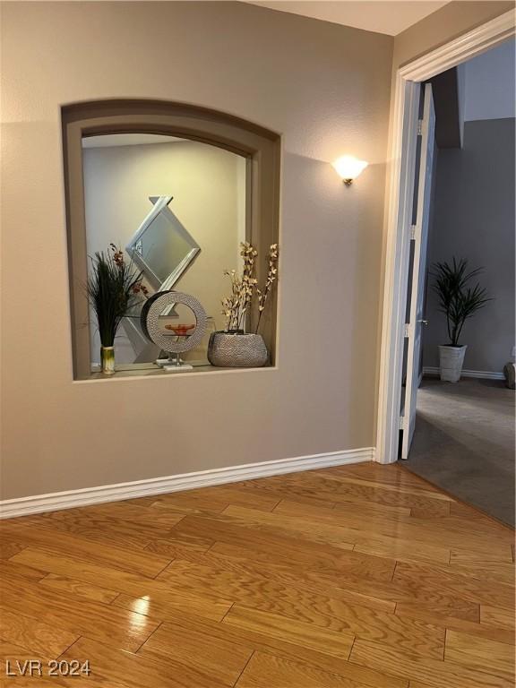 hallway featuring wood-type flooring