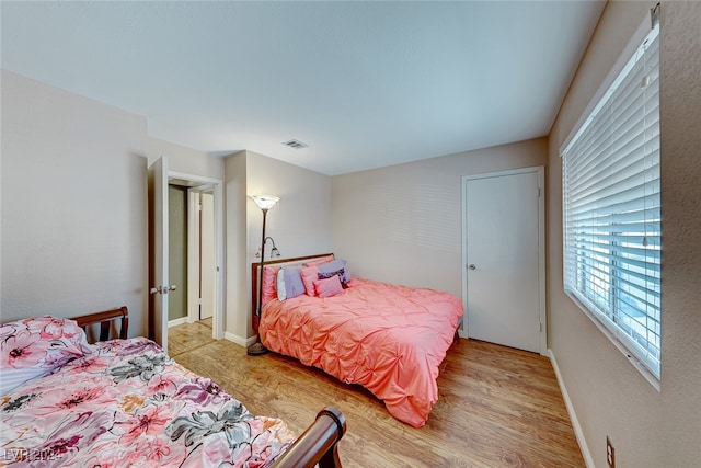 bedroom featuring light wood-type flooring