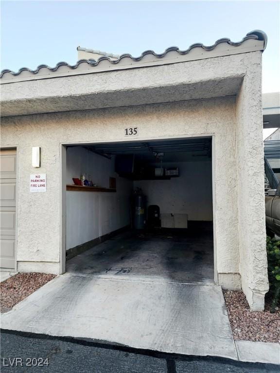 garage featuring electric water heater