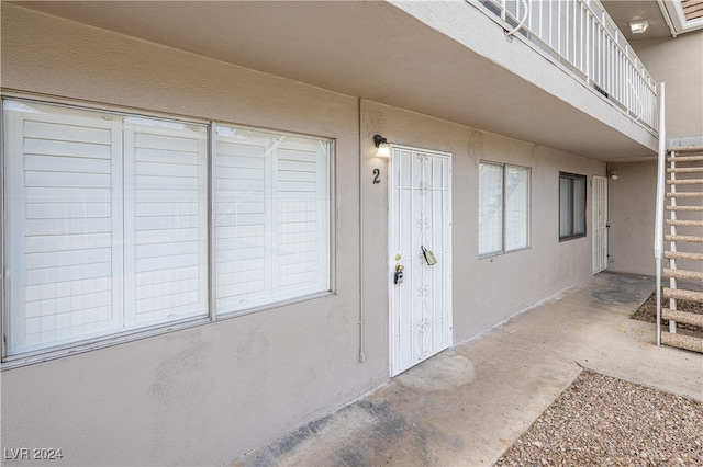 property entrance with a balcony