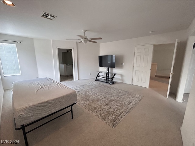 bedroom with ceiling fan and light colored carpet