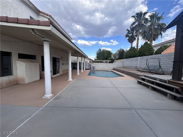 view of swimming pool featuring a patio