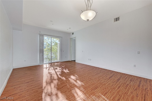 spare room featuring hardwood / wood-style floors