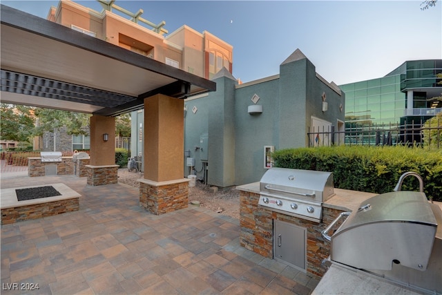 view of patio featuring area for grilling and a grill